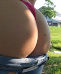 Heidi pulls off her jeans to show off her round ass