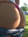 Heidi pulls off her jeans to show off her round ass