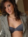 Melanie is slowly stripping out of her clothes after a long day at the office