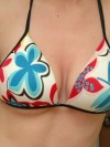 Amys huge boobs are popping out of her bikini top
