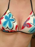 Amys huge boobs are popping out of her bikini top