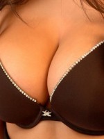 Brookes huge tits are popping out of her bra