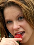 18 year old Kandie gets naked and enjoys some strawberrys in a park