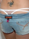 Kalees white thong is peeking out of her little jean shorts
