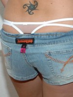 Kalees white thong is peeking out of her little jean shorts