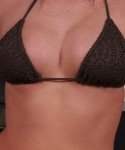 Alyssas huge perky boobs are barely covered by her tiny bikini top